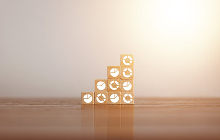 Woods block square step with pie chart. Growing and statistics graph. Success startup business concept. Data management system statistics and analytics. KPI report and Planning strategy.の写真素材