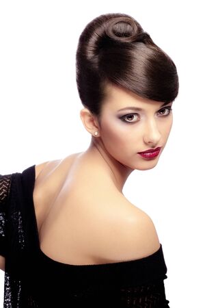 Attractive girl with beautiful hair and makeup isolated on whiteの写真素材
