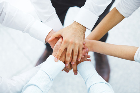 International business team showing unity with their hands togetherの写真素材