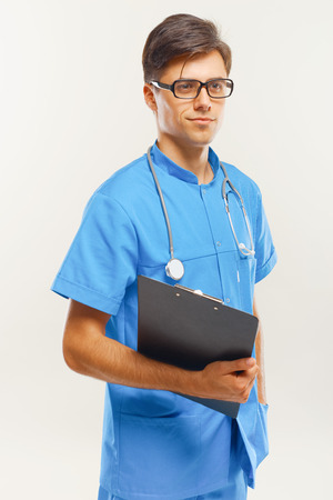 Doctor With Stethoscope Around his Neck Against Grey Backgroundの写真素材