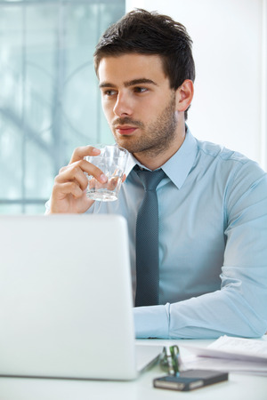 businessman with laptop working in officeの写真素材