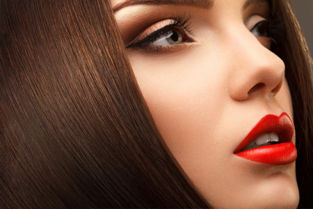 Woman Eye with Beautiful Makeup. Red Lips. High quality image.の写真素材