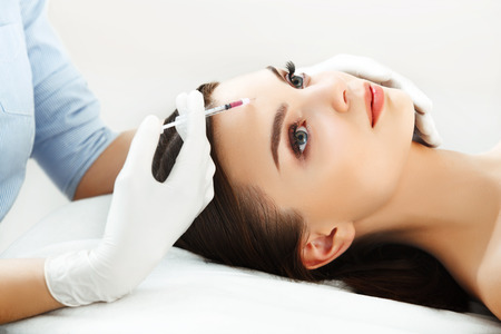 Beautiful woman gets injections. Cosmetology. Beauty Faceの写真素材