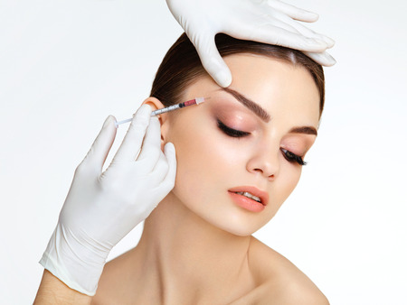 Beautiful woman gets injections. Cosmetology. Beauty Faceの写真素材