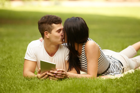 Kissing couple. Portrait of young caucasian couple kissingの写真素材