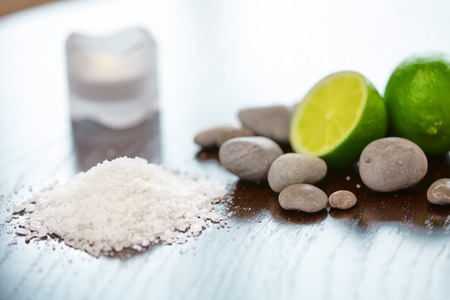 Spa Background. Sea Salt with Lime Stones and Candle . Body scrub.の写真素材