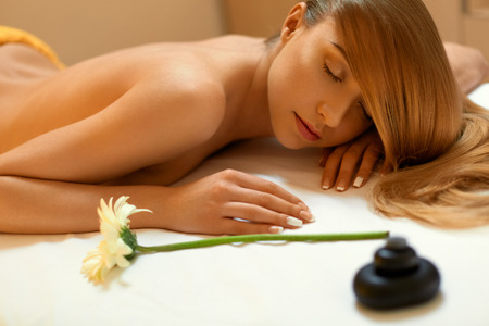 Spa Woman. Close-up of a Beautiful Woman Getting Spa Treatment. Massageの写真素材