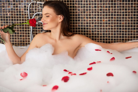 Beautiful Woman Takes Bubble Bath.の写真素材