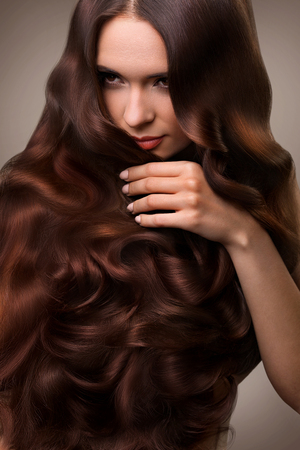 Hair. Portrait of Beautiful Woman with Long Wavy Hair. High quality image.の写真素材