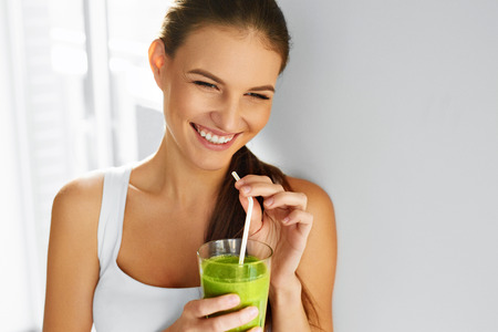 Diet. Healthy Eating Woman Drinking Fresh Raw Green Detox Vegetable Juice. Healthy Lifestyle, Vegetarian Food And Meal. Drink Smoothie. Nutrition Concept.