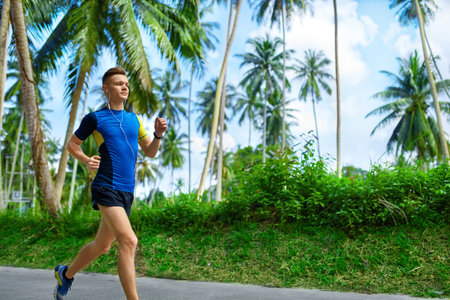 Fit Athlete Male Jogger Running On Road, Training For Marathon Run.