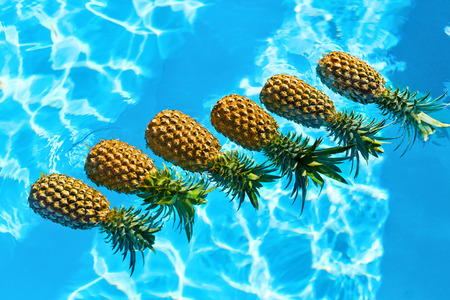 Juicy Fruit Background. Fresh Raw Organic Ripe Pineapples In Swimming Pool Water. Healthy Diet Food, Nutrition And Lifestyle. Eating Vitamins For Beauty, Health. Go Vegetarian. Hydration Concept.の写真素材