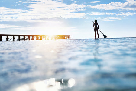 Summer Water Sports. Silhouette Of Free Fit Woman Paddling, Stand Up On Paddle, Surf Board In Sea....