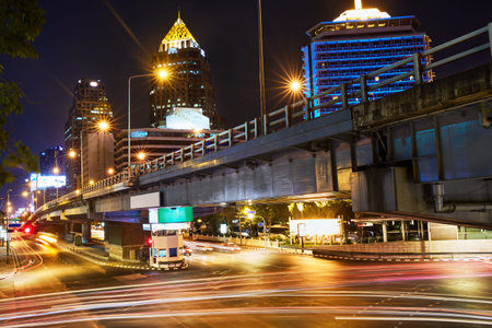 Cityscape Of Bangkok City, Thailand. Urban Landscape. Speed Traffic Under Bridge At Night, Light...
