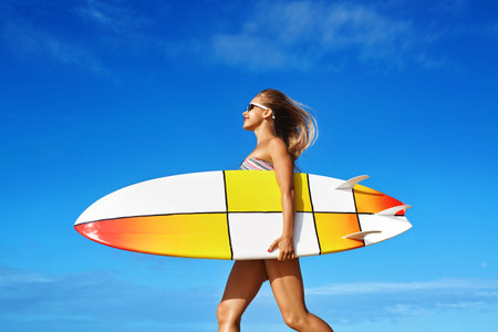 Healthy Active Lifestyle. Surfing. Water Sports. Beautiful Athletic Surfer Woman With Sexy Fit Body...