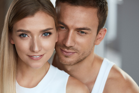 Beauty And Skin Care. Beautiful Couple In Love Closeup. Portrait Of Romantic Loving People, Happy Handsome Man And Smiling Woman With Fresh Soft Skin, Natural Face Makeup. Cosmetics. High Resolution