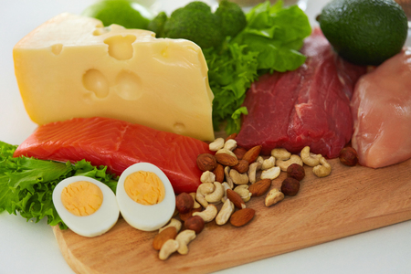 Healthy Foods. Closeup Of Variety Of Food Ingredients, Fresh Organic Vegetables, Raw Meats In Kitchen. Different Food Products Lying On Table. Nutrition Concept. High Resolutionの写真素材