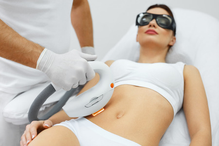 Cosmetic Procedure. Beautician Does Skin Resurfacing To Rejuvenate Beautiful Woman Body. Closeup Of Female Body Receiving Skin Dermabrasion. Beauty Treatment. High Resolutionの写真素材