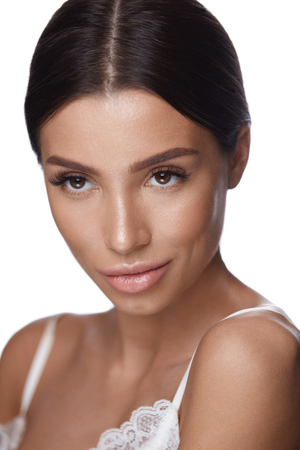 Beauty Cosmetics. Portrait Of Beautiful Sexy Female Face With Smooth Healthy Skin And Fresh Professional Makeup. Closeup Of Attractive Young Woman On White Background. Facial Care. High Resolutionの写真素材