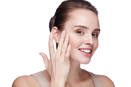 Beauty Make-Up. Closeup Of Beautiful Smiling Woman With Perfect Smooth Skin And Fresh Makeup. Portrait Of Attractive Young Female Model Touching Her Face. Facial Cosmetics. High Resolutionの写真素材