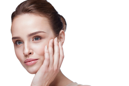 Woman Face Skin Care. Closeup Beautiful Sexy Woman With Perfect Professional Makeup Touching Her Smooth Soft Pure Clean Skin. Attractive Female Model Caressing Face. Beauty Cosmetics. High Resolutionの写真素材