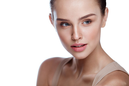 Facial Beauty. Closeup Of Beautiful Healthy Woman On White Background. Portrait Of Attractive Young Female Model With Perfect Fresh Fashionable Makeup And Pure Clean Skin. Cosmetics. High Resolutionの写真素材