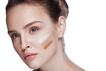 Beauty Makeup. Portrait Of Healthy Young Woman With Three Kinds Of Tonal Cream On Facial Skin. Close Up Of Attractive Sexy Female Woman With Fresh Natural Makeup. Skin Foundation. High Resolutionの写真素材