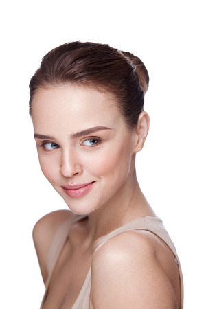 Beauty Face. Beautiful Smiling Girl With Perfect Facial Skin And Professional Makeup. Closeup Of Attractive Young Female Model With Glamourous Make-up On White Background. Cosmetics. High Resolutionの写真素材