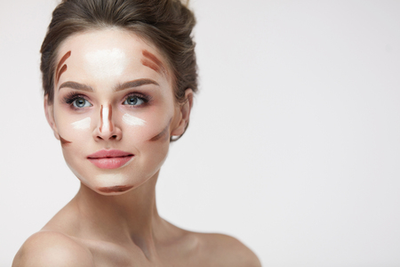 Beauty Cosmetics. Portrait Of Beautiful Sexy Female With Contouring And Highlighting Lines On Facial Skin. Closeup Of Attractive Young Woman With Fresh Natural Makeup Contour Lines. High Resolutionの写真素材