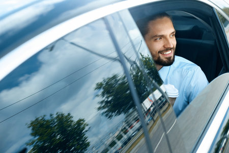 Business Man Going To Work In Car. Portrait Of Handsome Successful Young Businessman In Formal Wear...