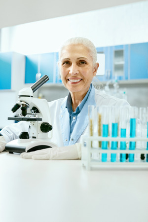 Laboratory. Female Scientist Working In Light Laboratory.の写真素材