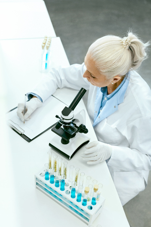 Laboratory. Female Scientist Working In Light Laboratory.の写真素材