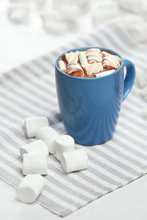 Cup Of Cocoa And Marshmallow. Close Up Of Blue Mug With Hot Tasty Beverage With Sweets On Table. Sweet Drinking Dessert. High Quality Image.の写真素材