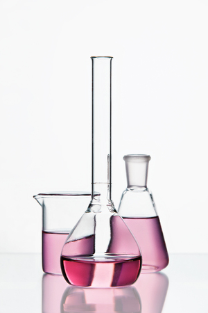 Laboratory Supplies. Transparent Glassware With Colorful Chemical Liquid On White Background. High Resolution.の写真素材