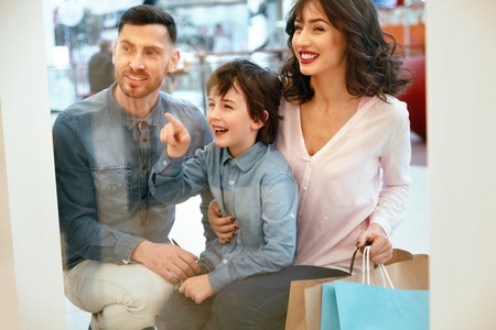 Family In Shopping Mall. Happy People Laughing And Looking Through Store Window. High Resolution.の写真素材