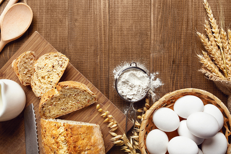 Baking Bread. Close Up Of Baking Ingredients And Products On Wood Table Still Life. High Resolutionの写真素材