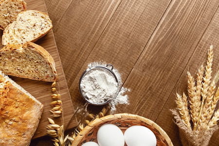 Baking Bread. Close Up Of Baking Ingredients And Products On Wood Table Still Life. High Resolutionの写真素材