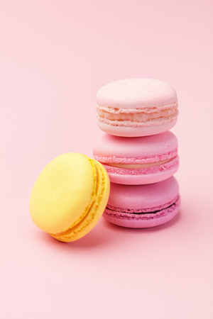 Macarons. Colorful French Macaroons On Pink Background. Dessert Or Cookies Still Life. High Resolutionの写真素材