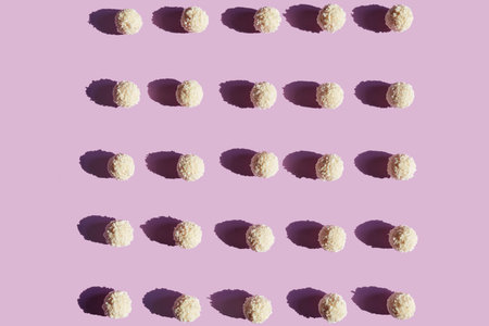 Sweets. Coconut Candy Balls On Purple Background. High Resolution