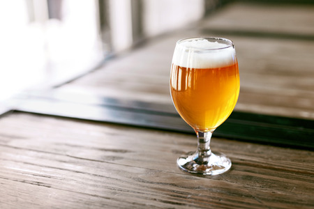 Beer Brewery. Glass Of Cold Fresh Wheat Beer On Wooden Table In Bar Pub. High Resolution.の写真素材
