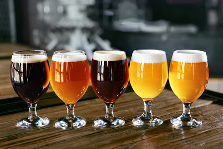 Beer Glasses On Wooden Table Closeup. Different Types Of Cold Fresh Beer In Bar Pub. High Resolution.の写真素材