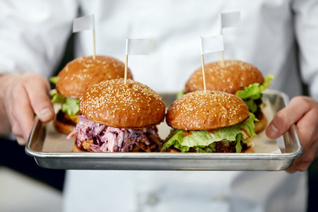 Food. Burgers And Hamburgers In Chef Hands Closeup. High Resolutionの写真素材