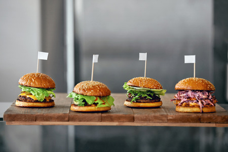 Food. Closeup Burgers And Hamburgers On Table In Fast Food Restaurant. High Resolutionの写真素材