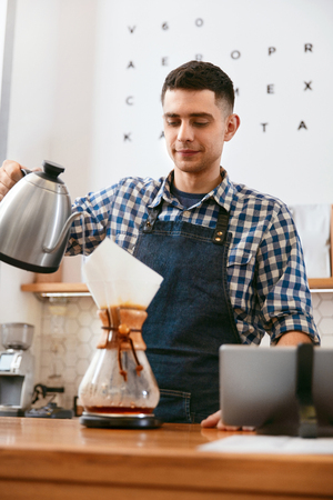 Coffee. Man Making Drink In Cafe, Pouring Hot Fresh Coffee Through Filter. High Resolution.の写真素材