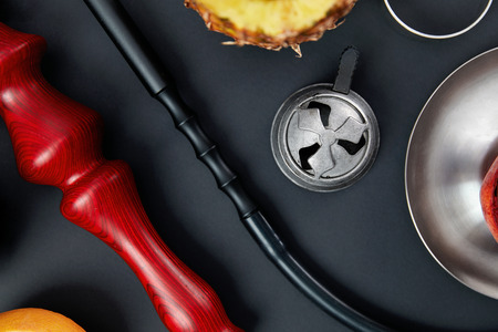 Shisha Hookah Details WIth Fruit Bowl On Black Background. Closeup Of Shisha Parts On Table. High Resolutionの写真素材
