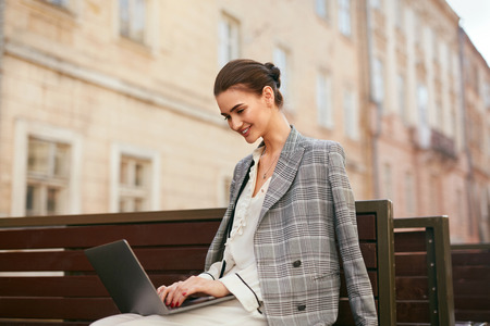 Business Woman Working On Computer At Street.の写真素材