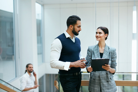 Business People In Working Environment. Team Of Man And Woman Working In Business Office Center. High Resolutionの写真素材