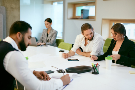 Business People Working, Meeting In Business Office. Men And Women Work Together In Modern Office Interior. High Resolutionの写真素材