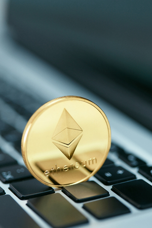 Cryptocurrency. Ethereum Coin On Computer Close Up. Digital Currency Symbol. High Resolutionの写真素材