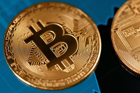 Bitcoin Cryptocurrency Closeup. Coin On Digital Display WIth Financial Exchange Market Analysis...